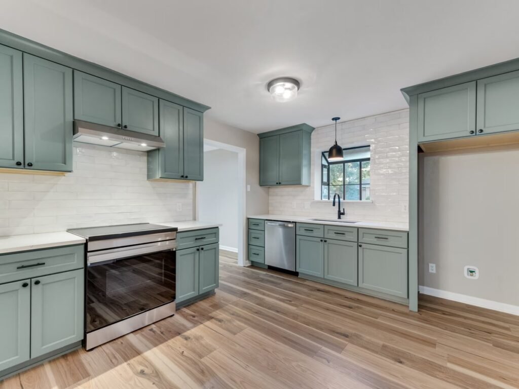 J&K Cabinetry Sage E3 green kitchen cabinets