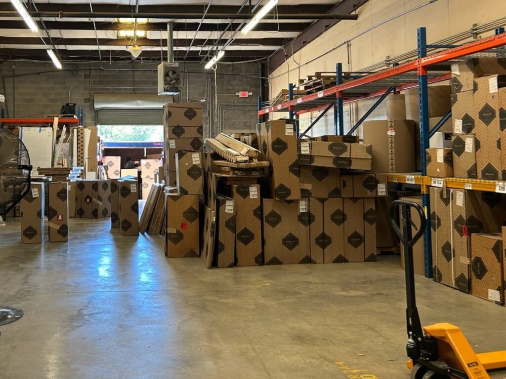 Boxed cabinet orders staged at the Land of Cabinets warehouse loading dock in Richmond, VA